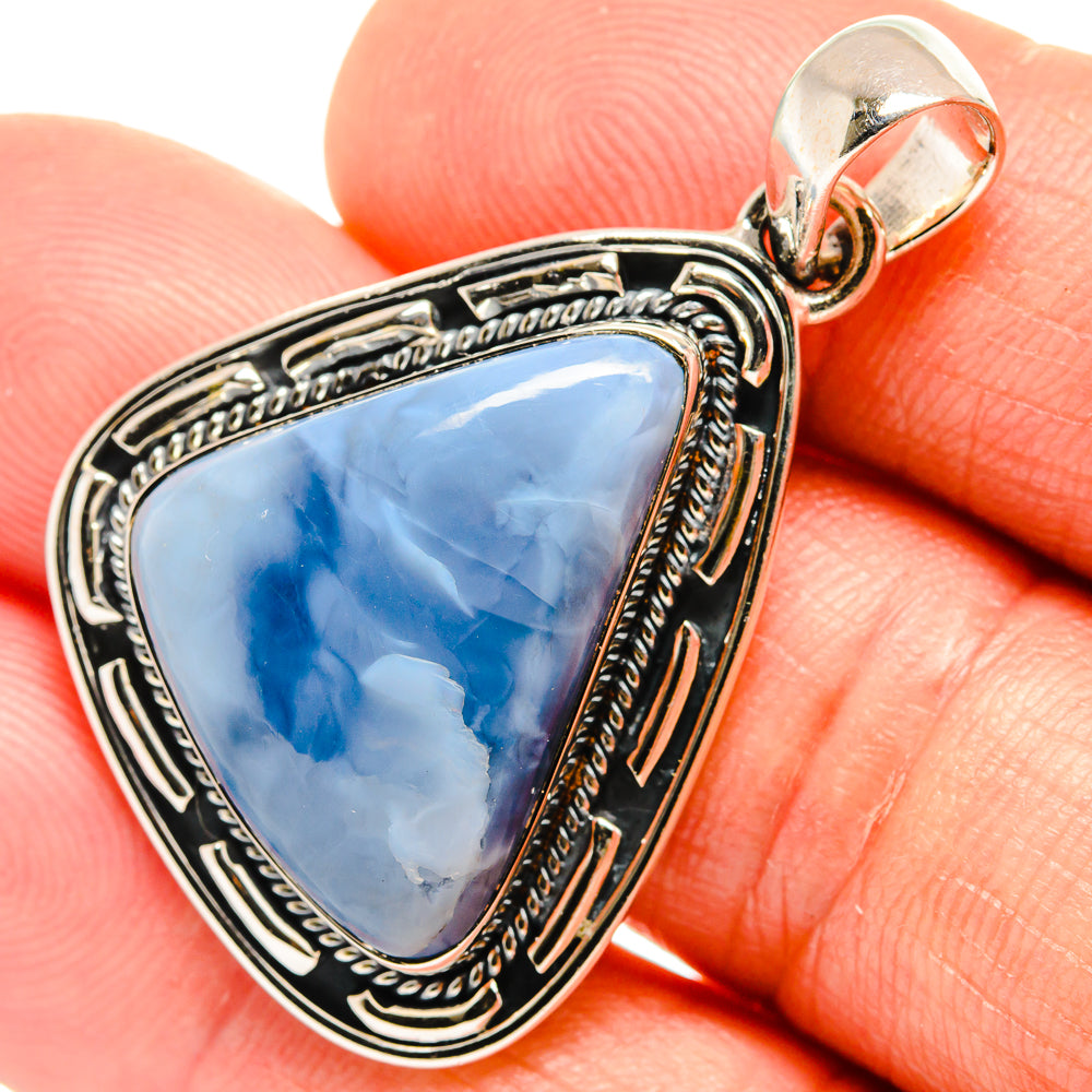 Triangular blue opal pendant in ornate 925 sterling silver bezel with loop bail