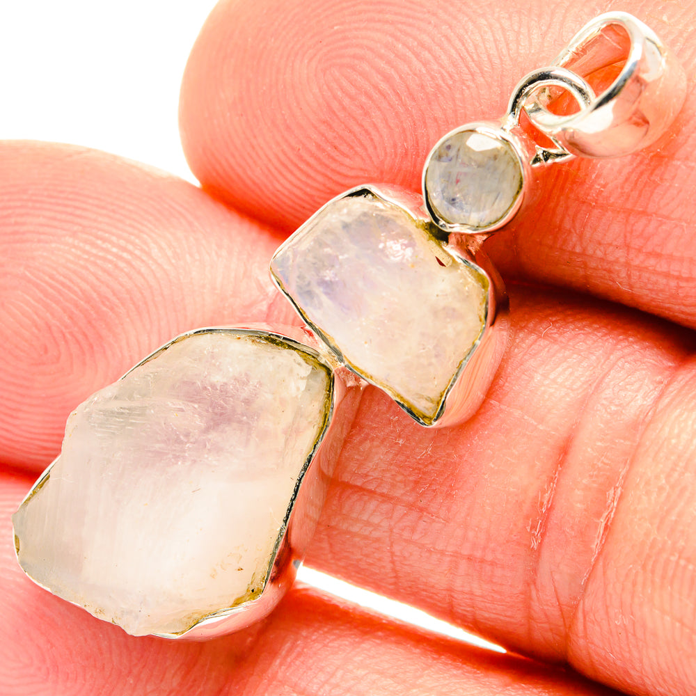 Close-up rough moonstone pendant stones in 925 sterling silver setting, polished bail