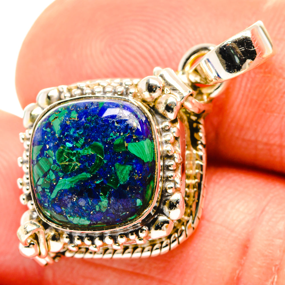 Sterling silver azurite pendant with oval blue-green stone bezel, bail loop detail