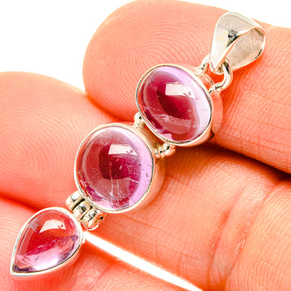Sterling silver gemstone pendant with three round pink stones, hinged bail