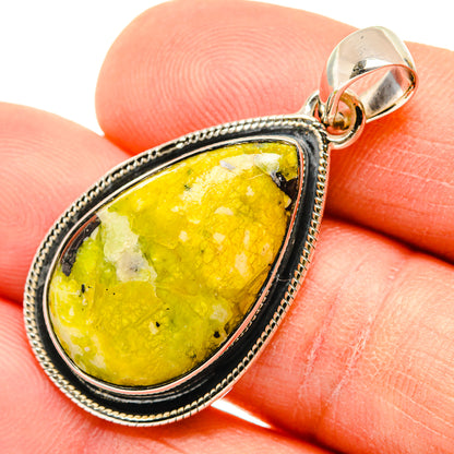 Teardrop sterling silver pendant with bright yellow stone, rope border, and bail