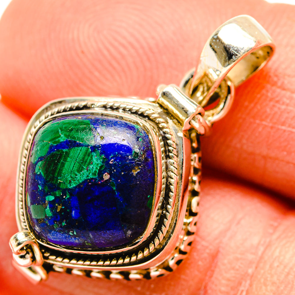 Gold-tone sterling silver azurite pendant closeup, oval blue-green cabochon bezel