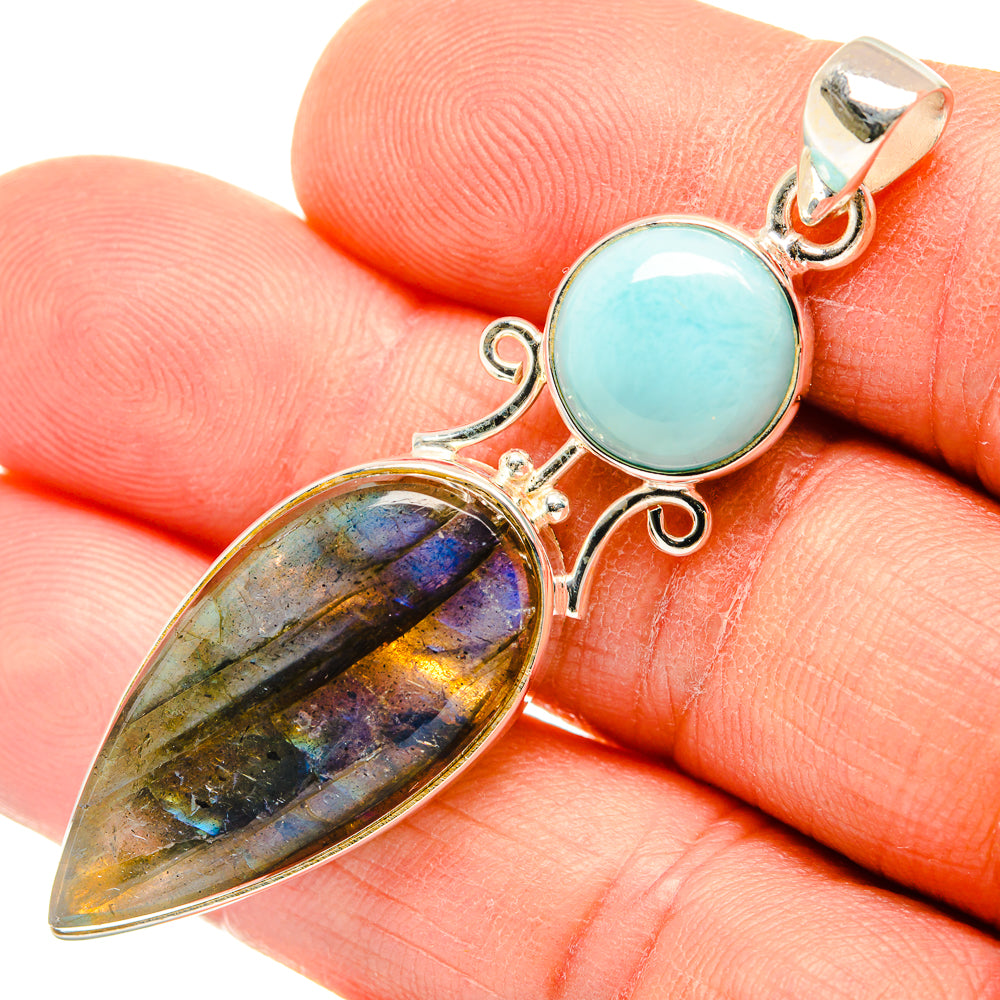 Sterling silver pendant on hand: round blue larimar cabochon and labradorite teardrop
