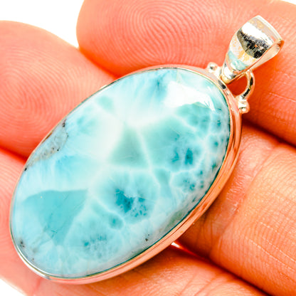 Larimar oval pendant close-up in 925 sterling silver bezel and hinged bail