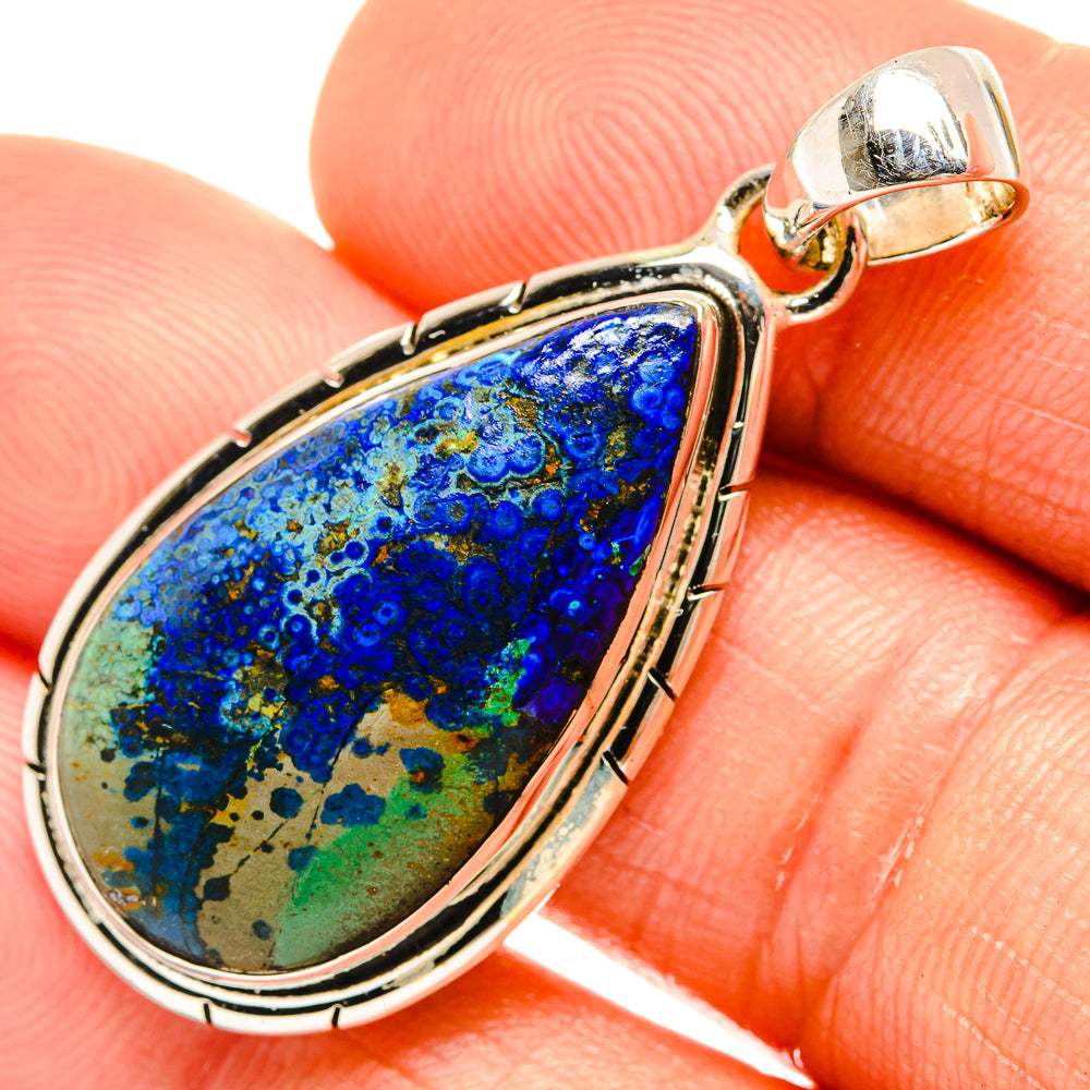 Azurite teardrop pendant close-up with blue-green stone set in sterling silver bezel