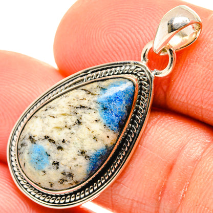 Azurite teardrop pendant in sterling silver with blue speckled stone and loop top