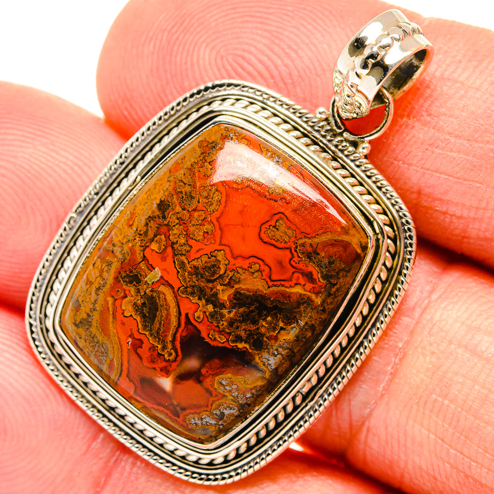 Sterling silver filigree agate pendant with orange-brown Moroccan stone and gold bail