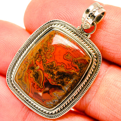 Sterling silver filigree agate pendant with orange-brown Moroccan stone and gold bail