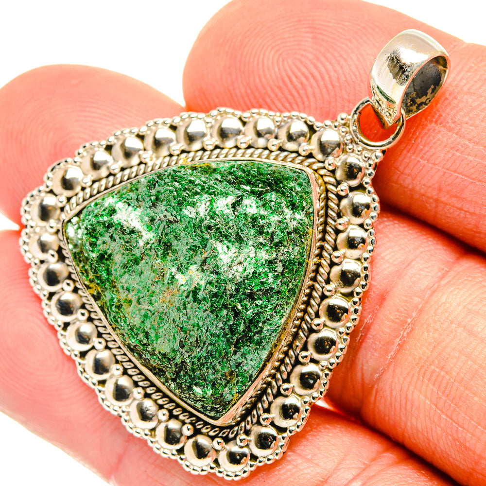 Green fuchsite triangle pendant close-up with 925 sterling silver scalloped frame.