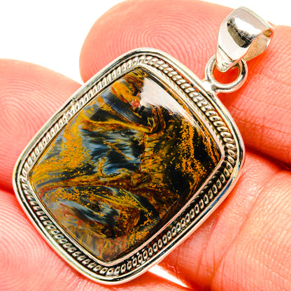 925 sterling silver pietersite pendant close-up with orange-blue stone in ornate frame
