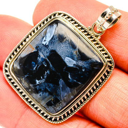 Square blue pietersite pendant with ornate gold-tone bezel and sterling silver bail
