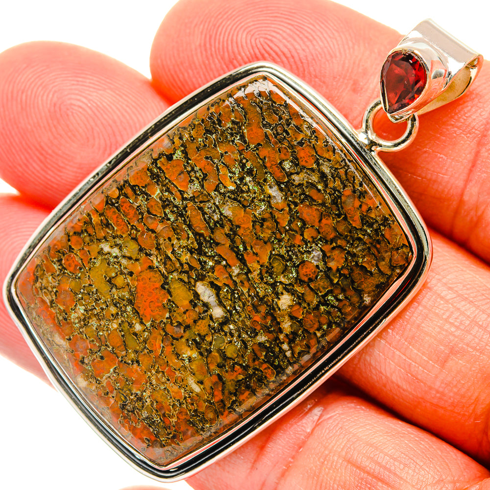 Sterling silver dinosaur bone pendant with garnet teardrop top and rectangular bezel