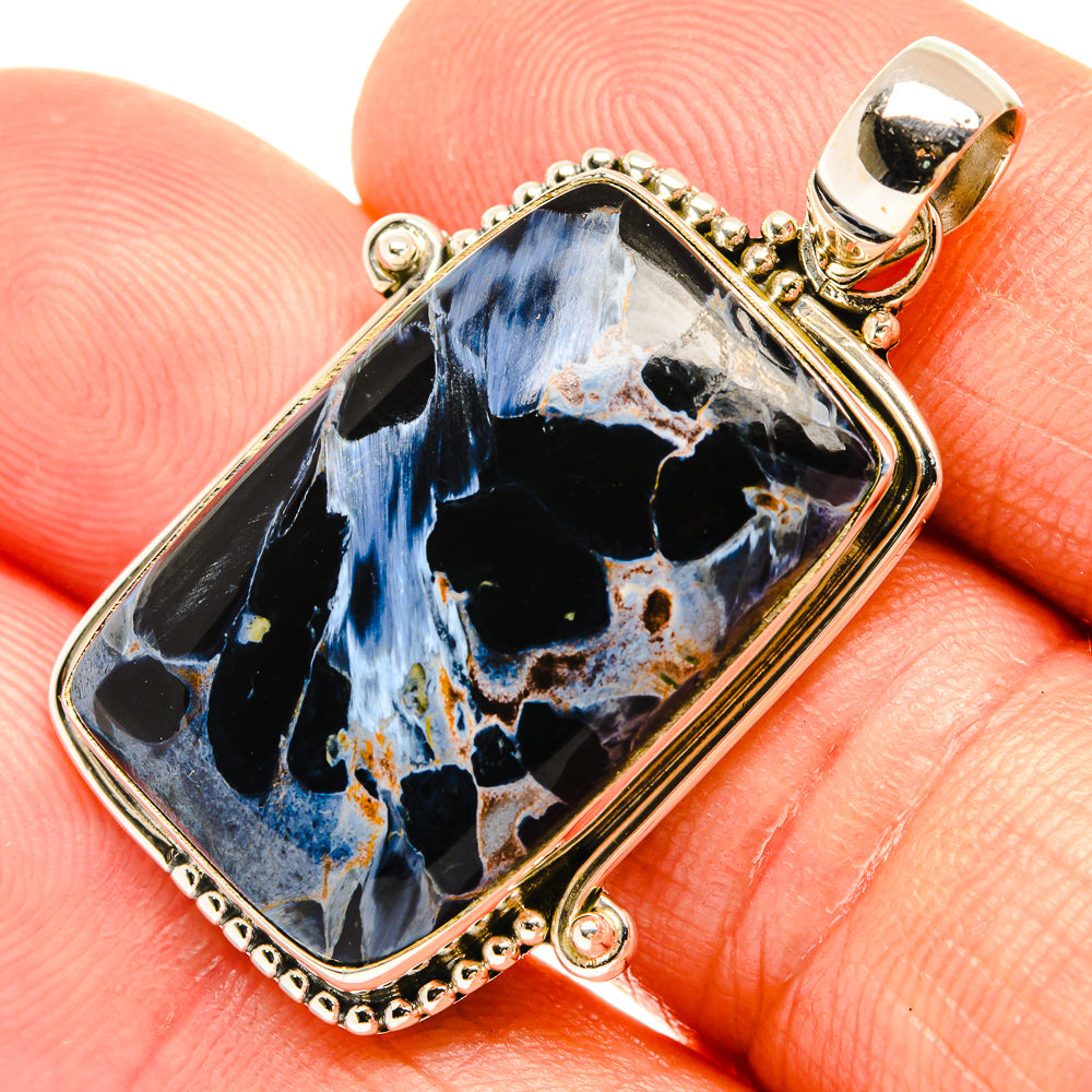 Rectangular sterling silver pietersite pendant on bail, blue flame-like patterns on dark stone