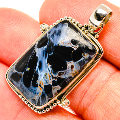 Rectangular sterling silver pietersite pendant on bail, blue flame-like patterns on dark stone