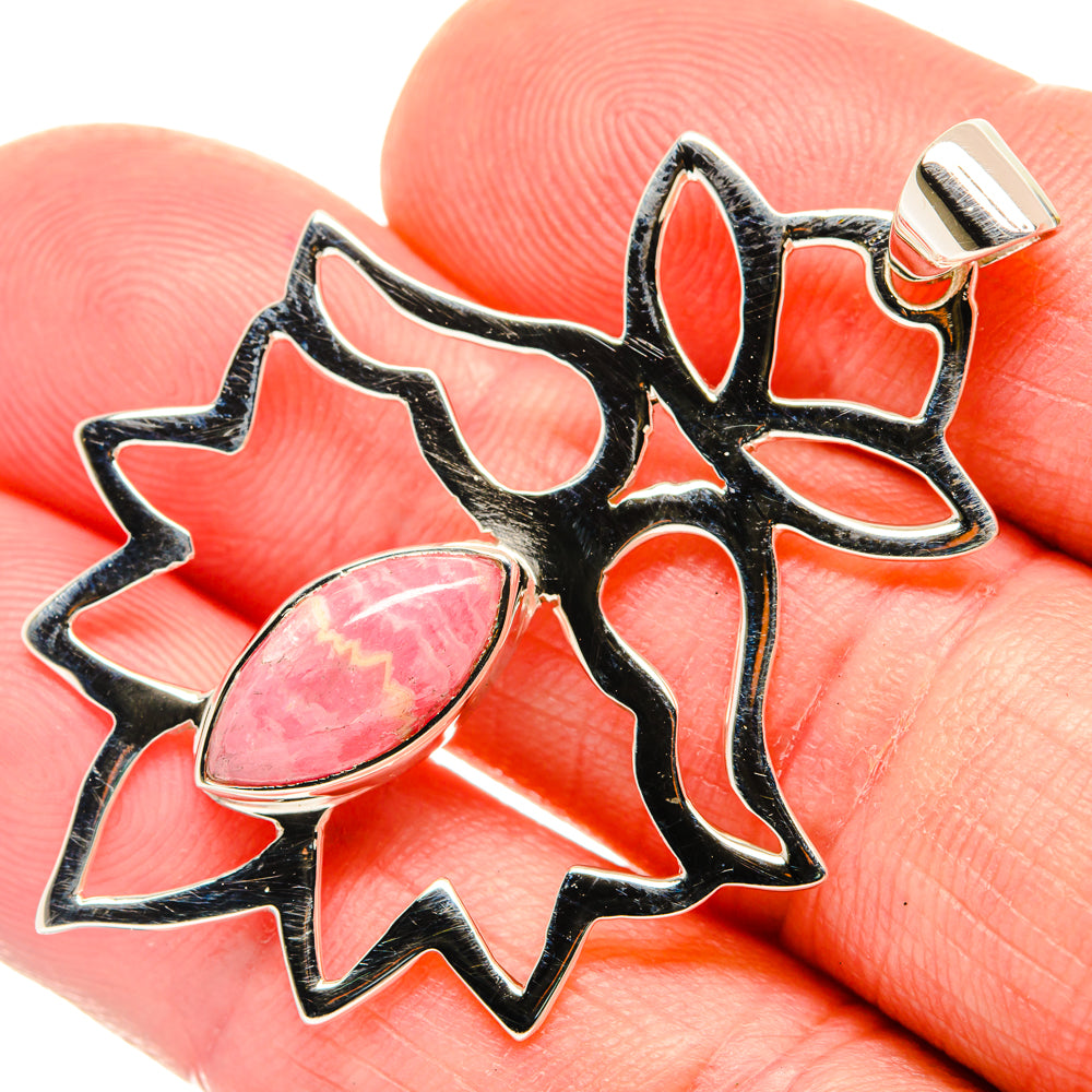 Sterling silver rhodochrosite pendant with black starburst setting and pink teardrop stone