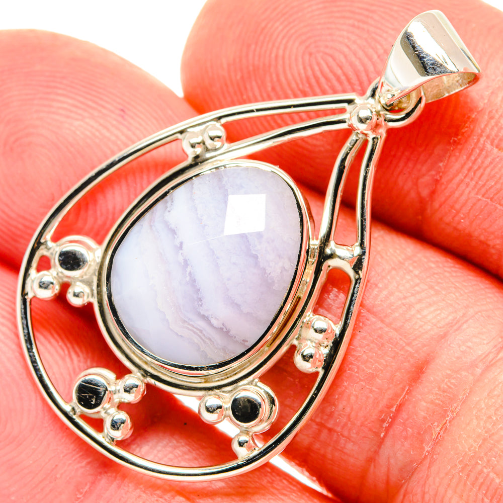 Sterling silver teardrop pendant with light blue lace agate cabochon and loop bail