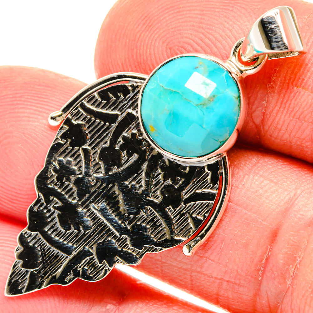 Chrysocolla pendant close-up: round turquoise stone in ornate 925 silver frame with bail