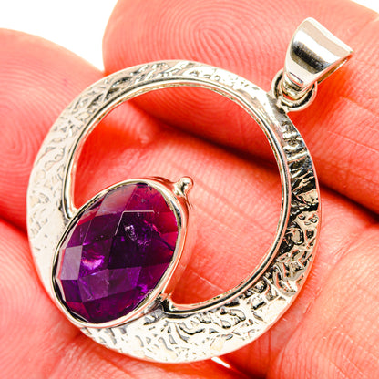 Oval amethyst pendant in textured silver setting with top bail and purple gemstone