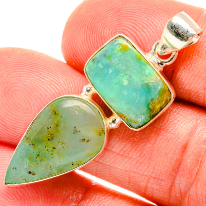 Two-stone pendant with silver bezel settings and green faceted cabochons, teardrop and square.