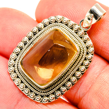 Sterling silver citrine sugarloaf pendant, orange-gold crystal in detailed border