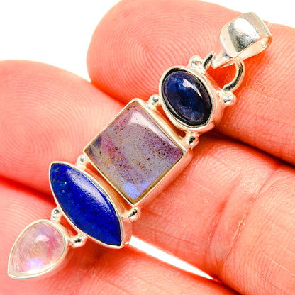 925 sterling silver pendant close-up with dark blue ovals, speckled square, and pink moonstone cabochon