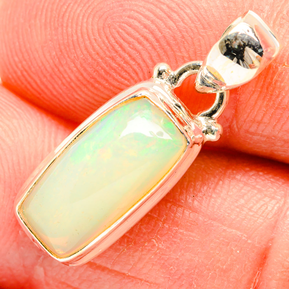 Natural Ethiopian opal pendant in 925 sterling silver, rectangular bezel with green glow