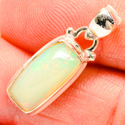 Natural Ethiopian opal pendant in 925 sterling silver, rectangular bezel with green glow
