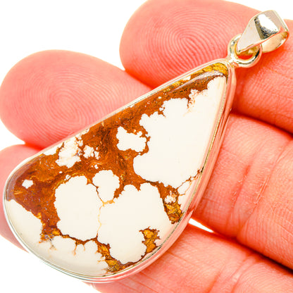 Teardrop jasper pendant close-up, white stone with brown web pattern, silver bail