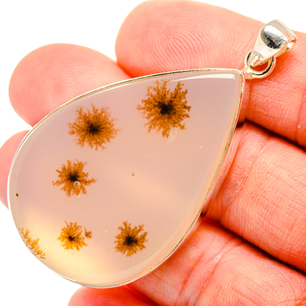 Sterling silver teardrop pendant with light pink agate and gold dendrite inclusions