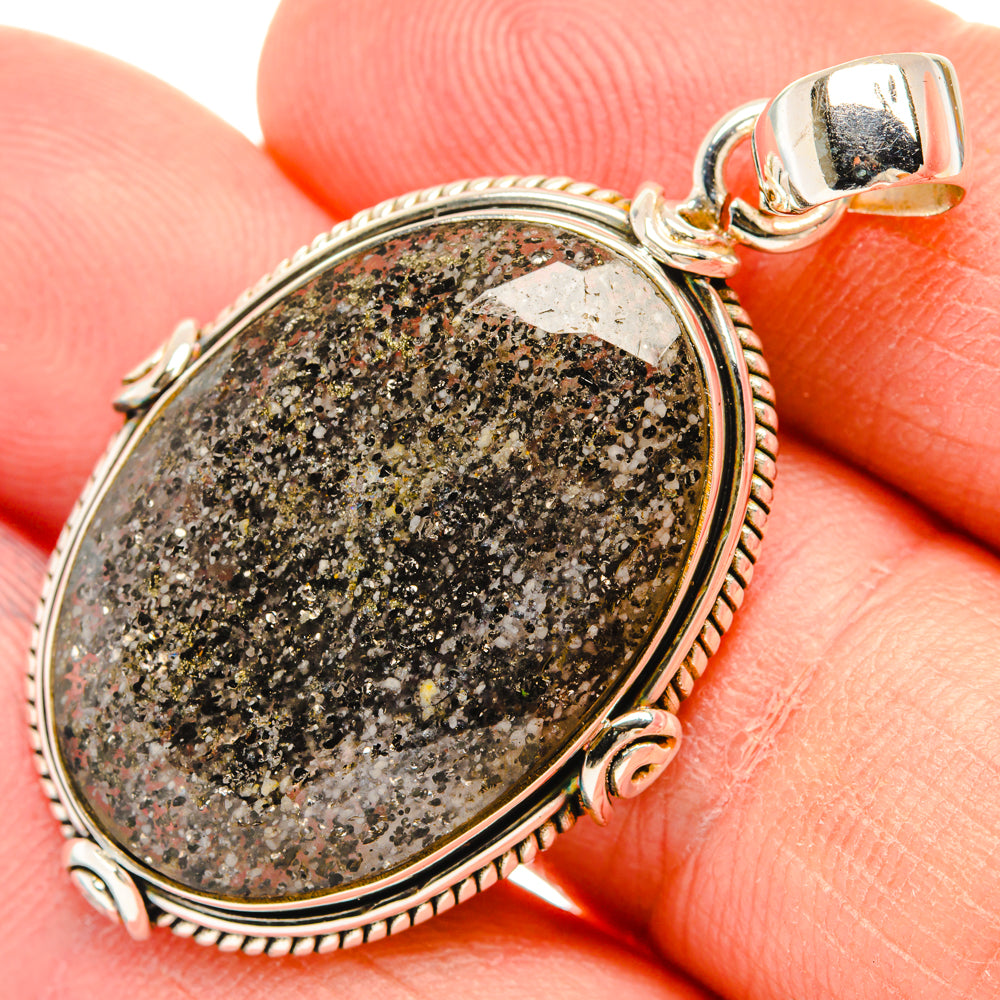 Oval speckled tourmalinated quartz pendant with round rope bezel and 925 sterling bail