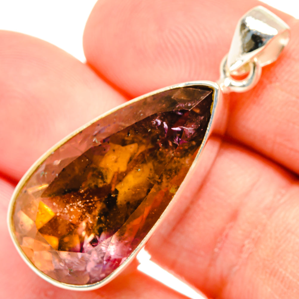 Ametrine teardrop pendant with faceted amber and purple stone in sterling silver setting