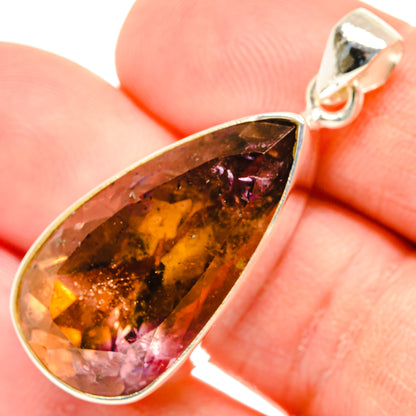Ametrine teardrop pendant with faceted amber and purple stone in sterling silver setting