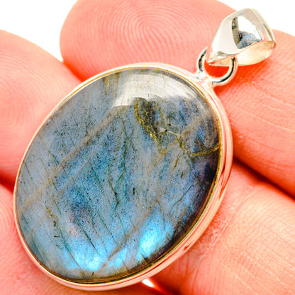 Oval labradorite pendant with blue iridescence in 925 sterling silver bezel