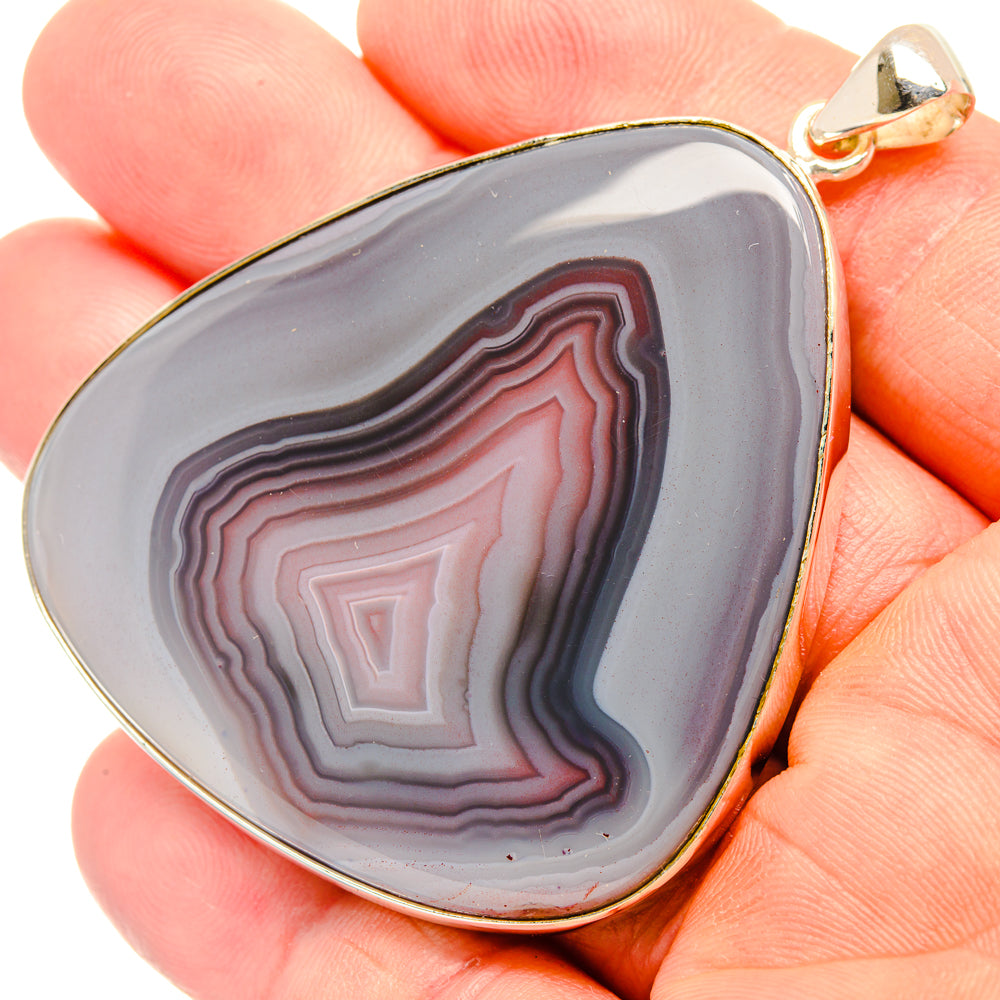 Botswana agate pendant, teardrop banded in purple-gray and red, set in 925 sterling silver