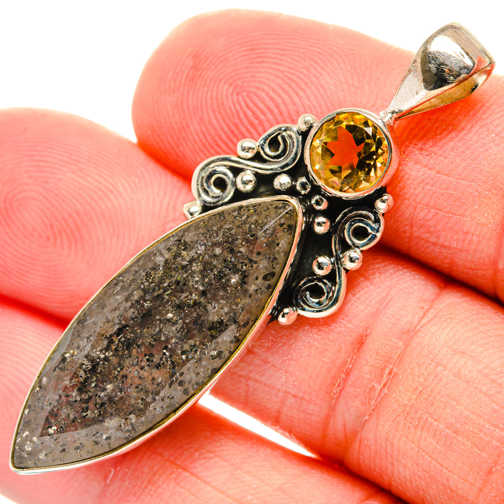 925 silver pendant on fingertip, dark marquise tourmalinated quartz and round citrine