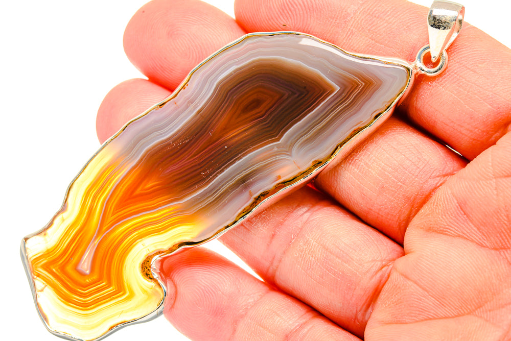 Botswana agate slice pendant in 925 sterling silver bezel, multicolor striped stone