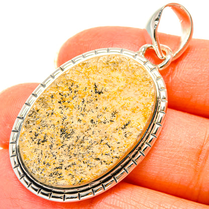 Sterling silver oval dendrite pendant, yellow with black needle-like inclusions, orange bail
