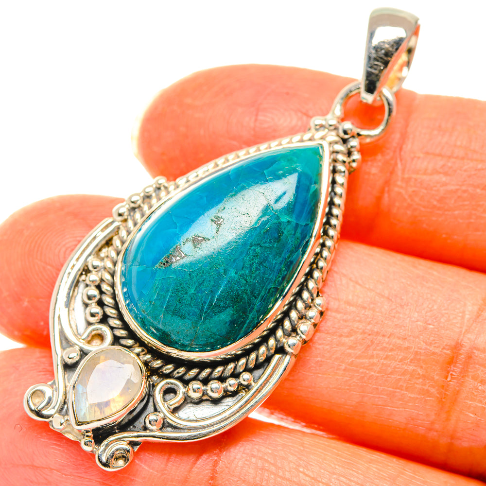 Turquoise teardrop pendant with filigree border and round opal-like stone on bail
