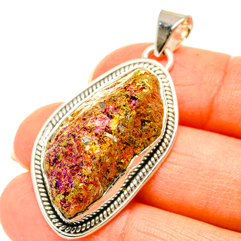 Oval sterling silver bezel pendant with multicolor ore stone cabochon and top bail