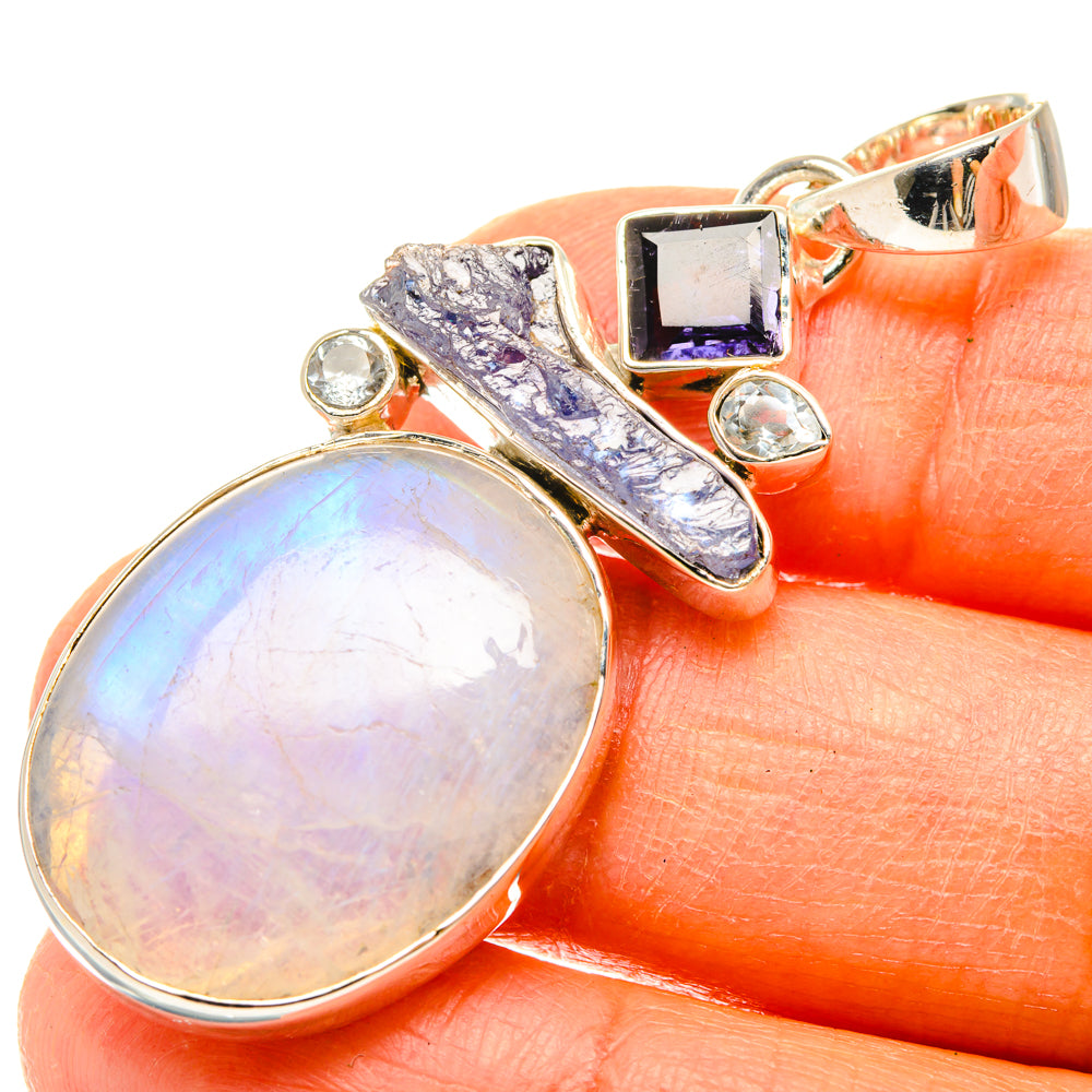 Sterling silver pendant with oval opalescent moonstone, blue topaz bar, square purple stone