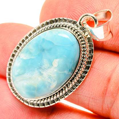 Sterling silver Larimar oval pendant with textured bezel and bail