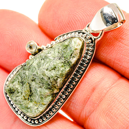 Sterling silver fuchsite pendant with oval green gemstone and beaded border bail
