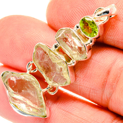 Rough green gemstone pendant in sterling silver, with round green accent at top
