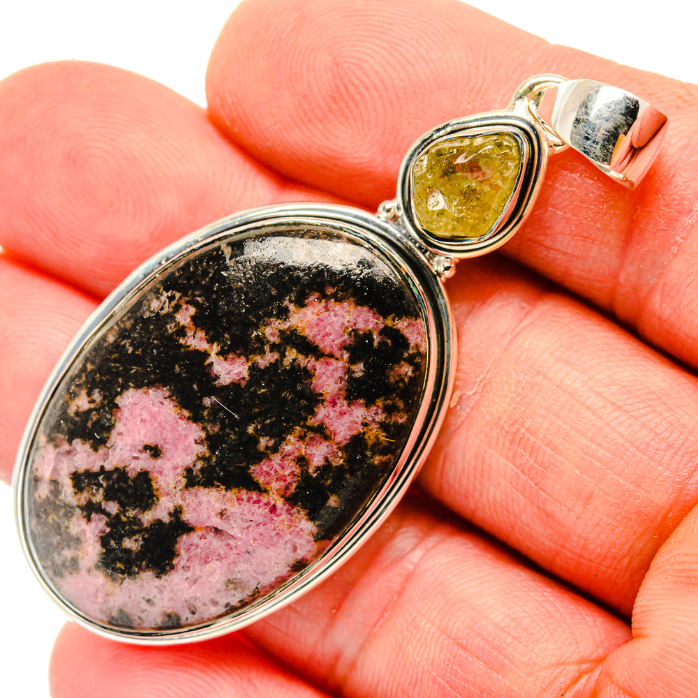 Sterling silver rhodonite oval pendant with small yellow citrine top detail, close-up