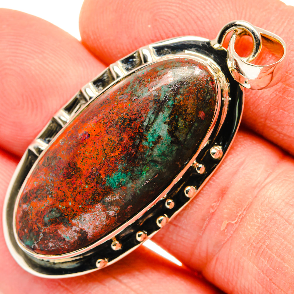 925 sterling silver oval pendant with green-orange cabochon and studded bezel