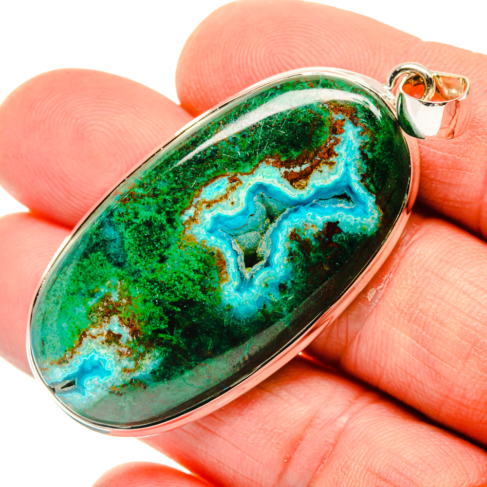 Oval pendant with turquoise-blue and green mottled stone in silver bezel