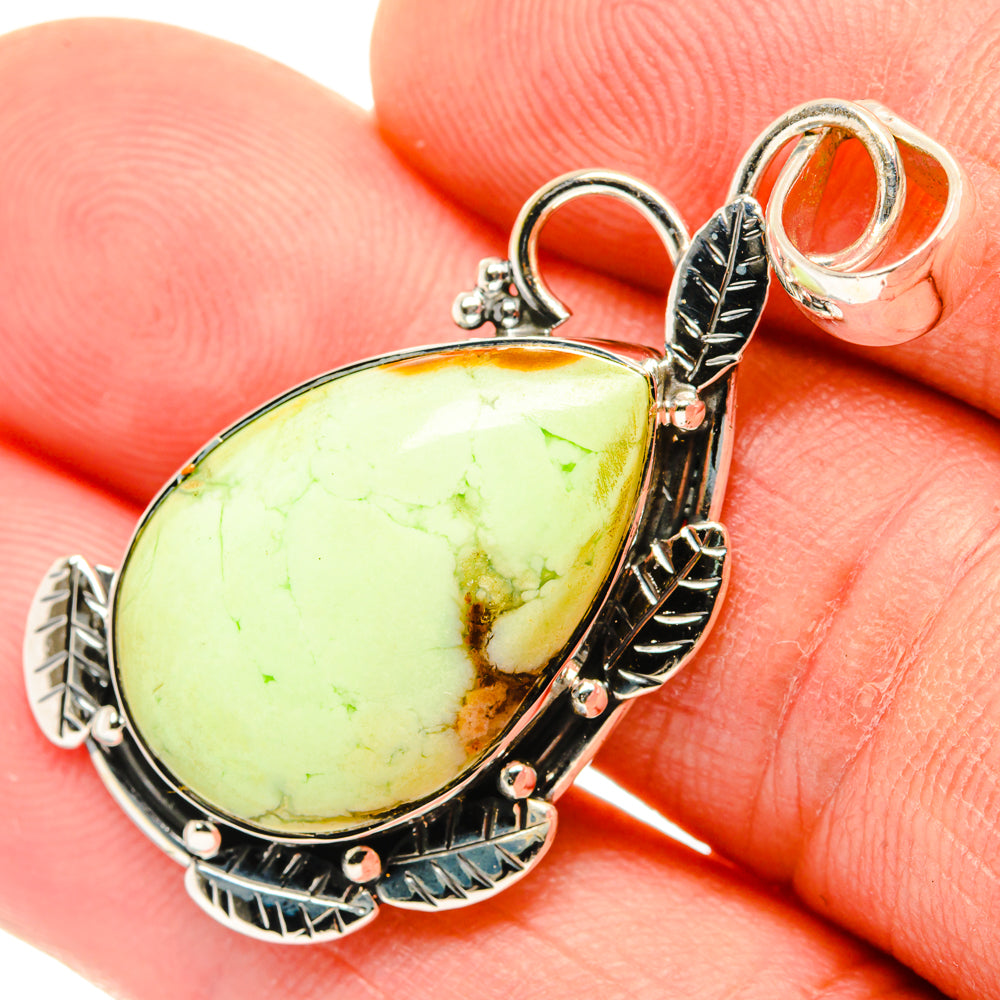 Sterling silver chrysoprase pendant with oval lemon-green stone, ornate bezel and bail