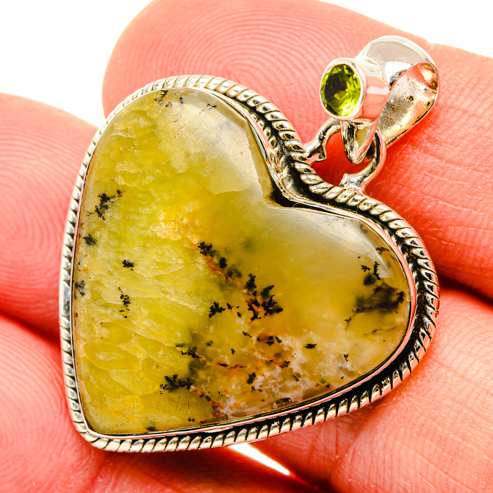 Heart-shaped yellow dendritic agate pendant with round green peridot and silver bail