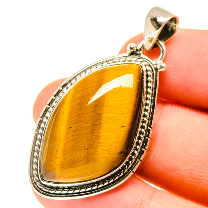 Tiger eye pendant in teardrop bezel with rope border, 925 sterling silver bail