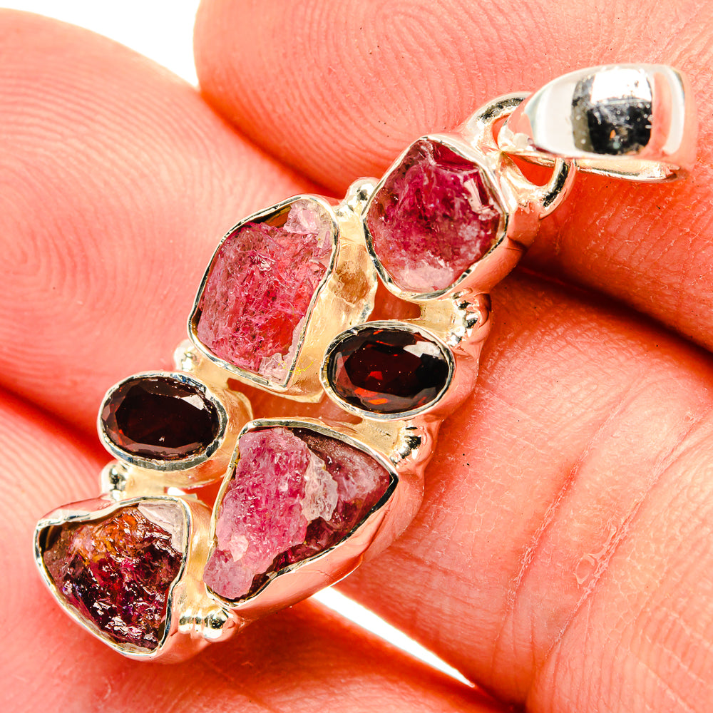 Sterling silver pendant charm with faceted rough pink tourmaline and red garnets, bail top